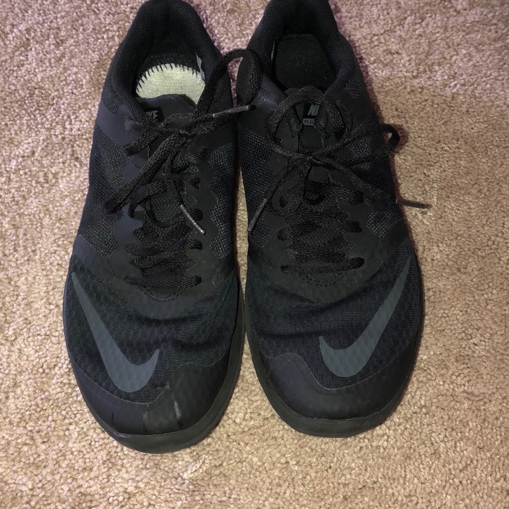 All black nike running or everyday gym shoes.